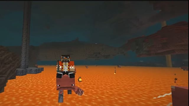 Using a saddle to ride a Strider in the Minecraft Nether update.