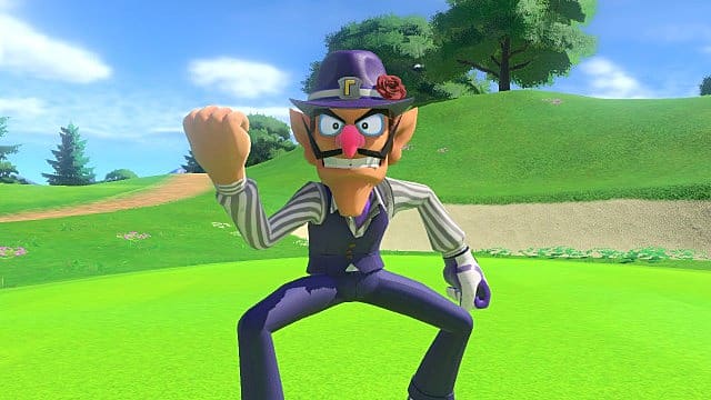 Waluigi shakes his fist on a putting green with a bunker behind him.