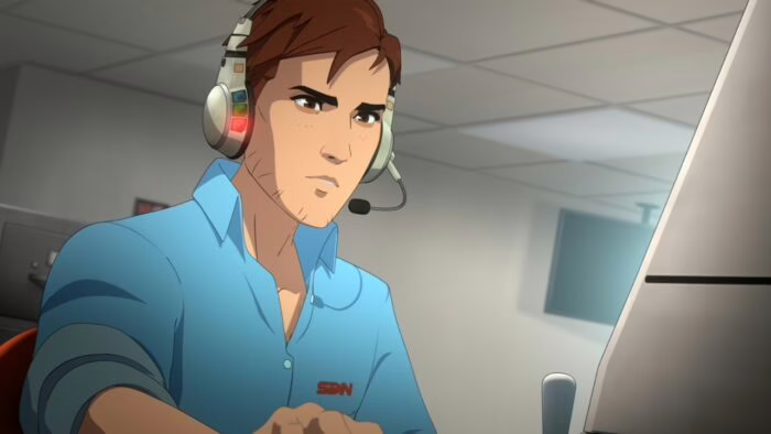 Jugador con auriculares frente a una pantalla en una oficina