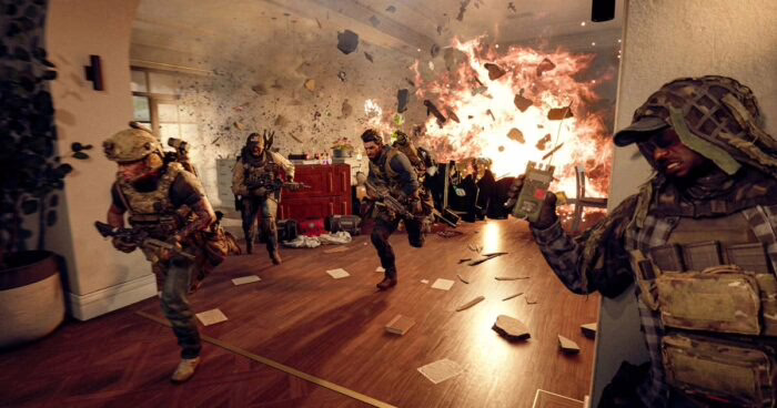 Soldados en acción en un edificio durante una explosión en Battlefield 6