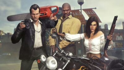 Frank West con motosierra y personajes en un set de película