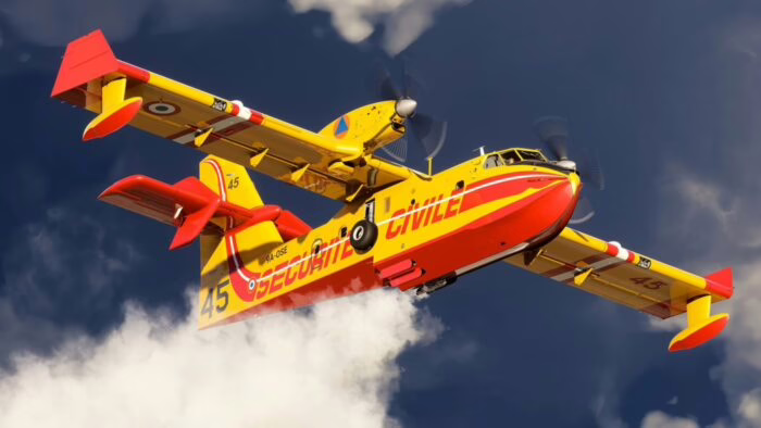 Avión amarillo y rojo volando sobre nubes en un cielo azul
