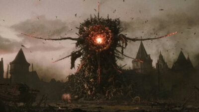 Criatura gigante con centro luminoso en un paisaje oscuro y fantasioso